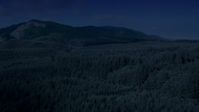 4K day for night color corrected aerial footage of evergreen forest, reveal the South Fork Tolt Reservoir, Cascade Range, Washington Aerial Stock Footage | AX48_058_DFN