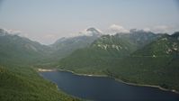 5K stock footage aerial video of wooded mountain peaks beside the South Fork Tolt Reservoir, Cascade Range, Washington Aerial Stock Footage | AX48_061