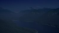 4K day for night color corrected aerial footage of wooded mountain peaks beside the South Fork Tolt Reservoir, Cascade Range, Washington Aerial Stock Footage | AX48_061_DFN