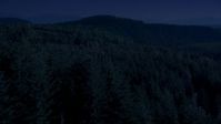 4K day for night color corrected aerial footage of a vast evergreen forest on a ridge in the Cascade Range, Washington Aerial Stock Footage | AX48_082_DFN