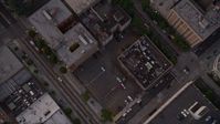 5K stock footage aerial video of bird's eye view of city streets and office Building, Downtown Seattle, Washington, sunset Aerial Stock Footage | AX50_061