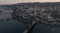 5K stock footage aerial video fly by downtown, over Willamette River, Steel Bridge, Downtown Portland, Oregon, sunset Aerial Stock Footage | AX54_067