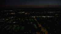 5K stock footage aerial video of flying over dark office building by neighborhood in Hillsboro, Oregon, night Aerial Stock Footage | AX55_071