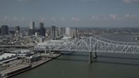5K stock footage aerial video of Crescent City Connection Bridge and Downtown New Orleans skyscrapers, Louisiana Aerial Stock Footage | AX59_011