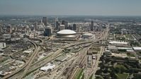 5K stock footage aerial video approach the freeway interchange by the Superdome, and Downtown New Orleans skyscrapers, Louisiana Aerial Stock Footage | AX59_039