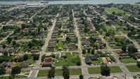 5K stock footage aerial video fly over the Lower Ninth Ward and approach the Mississippi River, New Orleans, Louisiana Aerial Stock Footage | AX59_054
