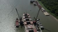 5K stock footage aerial video approach and tilt to a cargo ship on Mississippi River, Louisiana Aerial Stock Footage | AX60_015
