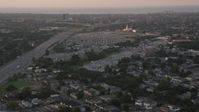 5K stock footage aerial video of Greenwood Cemetery and First Baptist New Orleans church at sunset, Lakeview, Louisiana Aerial Stock Footage | AX61_030