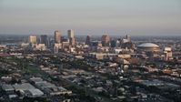 5K stock footage aerial video approach skyscrapers in Downtown New Orleans at sunset, Louisiana Aerial Stock Footage | AX61_035