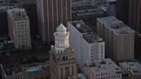 5K stock footage aerial video approach the tower atop the Hibernia Bank building at sunset, Downtown New Orleans, Louisiana Aerial Stock Footage | AX61_045