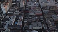 5K stock footage aerial video of French Quarter's famous Bourbon Street and cross streets at sunset, New Orleans, Louisiana Aerial Stock Footage | AX61_059