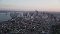 5K stock footage aerial video of a view across the French Quarter at Downtown New Orleans at sunset, Louisiana Aerial Stock Footage | AX61_062