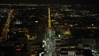 5K stock footage aerial video follow Canal Street through Downtown New Orleans at night, Louisiana Aerial Stock Footage | AX63_019