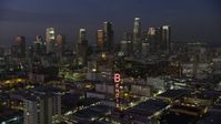 5K stock footage aerial video approach Bendix Sign and Downtown Los Angeles skyscrapers, California, twilight Aerial Stock Footage | AX64_0244