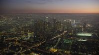 5K stock footage aerial video of tall skyscrapers and Highway 110 in Downtown Los Angeles, California at twilight Aerial Stock Footage | AX64_0263