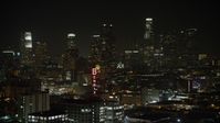 5K stock footage aerial video approach the Bendix Sign and the Downtown Los Angeles skyline, California, night Aerial Stock Footage | AX64_0389