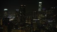 5K stock footage aerial video approach Aon Center in Downtown Los Angeles, California, night Aerial Stock Footage | AX64_0391