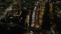 5K stock footage aerial video of heavy traffic on Highway 110, Downtown Los Angeles, California night Aerial Stock Footage | AX64_0404