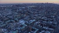 4.8K stock footage aerial video of Columbia University, reveal Midtown Manhattan skyline in winter, New York City, twilight Aerial Stock Footage | AX66_0291