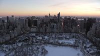 4.8K stock footage aerial video of Midtown Manhattan skyscrapers in winter, New York City, twilight Aerial Stock Footage | AX66_0307