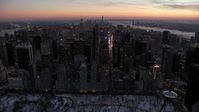 4.8K stock footage aerial video approaching Times Square and Midtown Manhattan in winter, New York City, twilight Aerial Stock Footage | AX66_0335