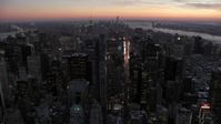 4.8K stock footage aerial video an approach to Times Square and Midtown in winter, New York City, twilight Aerial Stock Footage | AX66_0336