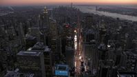 4.8K stock footage aerial video tilt to Times Square and Midtown in winter, New York City, twilight Aerial Stock Footage | AX66_0338