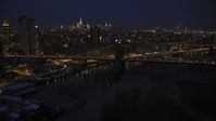 4.8K stock footage aerial video approach Brooklyn Bridge in winter, New York City, night Aerial Stock Footage | AX66_0404