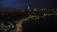 4.8K stock footage aerial video of a wide view of the Midtown Manhattan skyline, New York City, night Aerial Stock Footage | AX66_0413