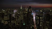 4.8K stock footage aerial video of Midtown Manhattan skyscrapers, New York City, night Aerial Stock Footage | AX66_0432