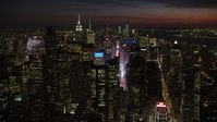 4.8K stock footage aerial video of Times Square and Midtown Manhattan skyscrapers, New York City, night Aerial Stock Footage | AX66_0433