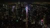 4.8K aerial video view follow 7th Avenue to approach Times Square at night, Midtown Manhattan, New York City, New York Aerial Stock Footage | AX67_0027