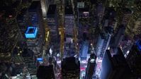4.8K aerial video view tilt to the bright lights of Times Square at night, Midtown Manhattan, New York City, New York Aerial Stock Footage | AX67_0032