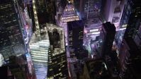 4.8K aerial video view of Times Square and Midtown skyscrapers at night, New York City, New York Aerial Stock Footage | AX67_0034