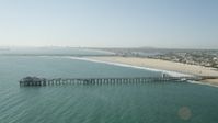4.8K stock footage aerial video of Seal Beach Municipal Pier and the beach by coastal homes in Seal Beach, California Aerial Stock Footage | AX68_123