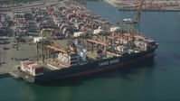 4.8K stock footage aerial video approach and flyby a cargo ship being unloaded at the Port of Los Angeles, California Aerial Stock Footage | AX68_167