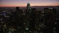 4.8K stock footage aerial video orbit around Downtown Los Angeles skyscrapers at night, California Aerial Stock Footage | AX69_106