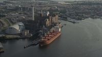 5.1K stock footage aerial video of a cargo ship docked by the Domino Sugar Factory, Baltimore, Maryland Aerial Stock Footage | AX73_101