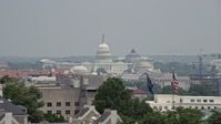 4.8K stock footage aerial video of the United States Capitol seen over Smithsonian Museum domes in Washington DC Aerial Stock Footage | AX74_077E