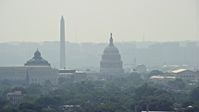 4.8K stock footage aerial video of the United States Capitol and the Thomas Jefferson Building domes behind the John Adams Building in Washington DC Aerial Stock Footage | AX75_062E
