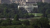 4.8K stock footage aerial video the White House and South Lawn, reveal part of Washington Monument in Washington DC Aerial Stock Footage | AX75_077E
