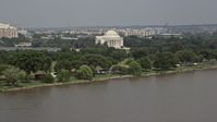 4.8K stock footage aerial video of Jefferson Memorial seen from the Potomac River in Washington DC Aerial Stock Footage | AX75_080
