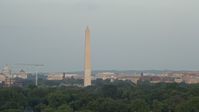 4.8K stock footage aerial video of the Washington Monument, reveal the United States Institute of Peace, Washington D.C., sunset Aerial Stock Footage | AX76_052