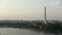 4.8K stock footage aerial video of the Old Executive Office Building, The White House, and Washington Monument, Washington D.C., sunset Aerial Stock Footage | AX76_065