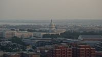 4.8K stock footage aerial video of the United States Capitol behind the Russell Senate Office Building, Washington D.C., sunset Aerial Stock Footage | AX76_086