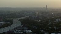 4.8K stock footage aerial video of Interstate 695, Capitol Power Plant, and Washington Monument, Washington D.C., sunset Aerial Stock Footage | AX76_094