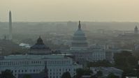 4.8K stock footage aerial video Library of Congress, United States Capitol, Washington Monument, Supreme Court, Washington D.C., sunset Aerial Stock Footage | AX76_096