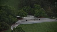 4.8K stock footage aerial video of President John F. Kennedy Gravesite at Arlington National Cemetery, Arlington, Virginia, twilight Aerial Stock Footage | AX76_114