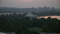 4.8K stock footage aerial video of the Jefferson Memorial beside Tidal Basin in Washington, D.C., twilight Aerial Stock Footage | AX76_149