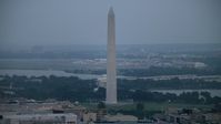 4.8K stock footage aerial video of the Washington Monument, the Jefferson Memorial, and Reagan National Airport in Washington, D.C., twilight Aerial Stock Footage | AX76_159